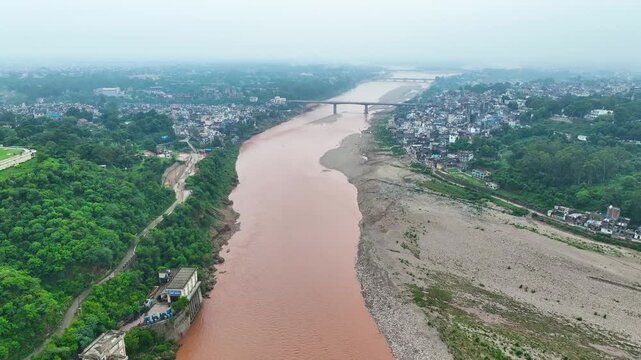 Drone view of Jammu floods during monsoon, highlighting climate vulnerability and dense settlements along the Tawi River.