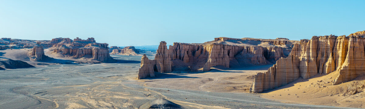 Aerial view of majestic wind-eroded yardang landforms and sand ridges in the dry desert of Dahaidao, Xinjiang, China