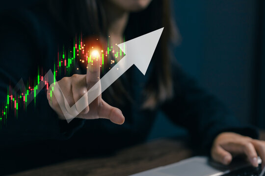 Businesswoman interacting with a rising financial chart, representing stock market growth, investment success, trading performance, business analytics, and economic development.