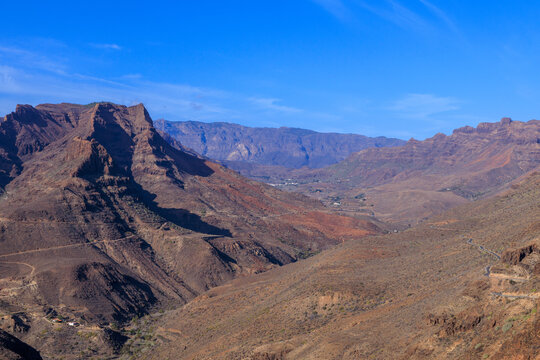 Panorama with mountains and canyon Fataga ravine (Barranco de Fataga) seen from viewpoint Mirador Degollada de las Yeguas on Canary Island Gran Canaria, Spain