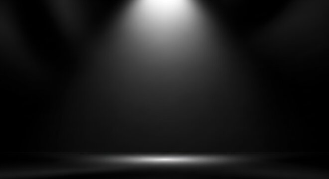 Bright illumination radiates from overhead spotlights onto a dark, empty stage floor