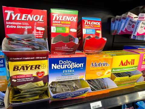 Over The Counter Pain Relievers Displayed On Pharmacy Shelf