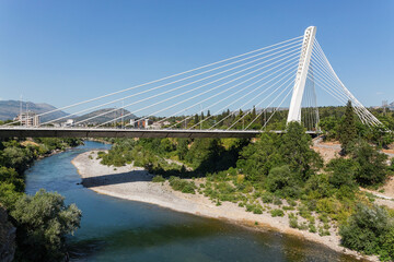 Fototapeta premium Millennium Bridge over Moraca River in Podgorica, Montenegro with scenic summer landscape