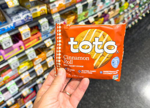 Toto Cinnamon Roll Cookies Held In Grocery Store