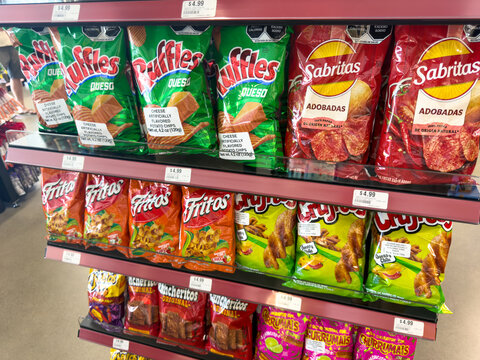 Assorted Mexican Snack Chip Bags On Grocery Shelf