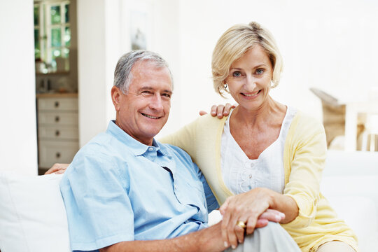 Portrait holding hands and love with old couple in home for bonding, connection and marriage. Retirement, support and commitment with senior man and woman in living room of house for relax and care