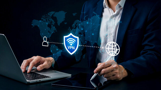 Professional businessman using laptop and tablet for secure VPN connection with global network interface and cyber security protection