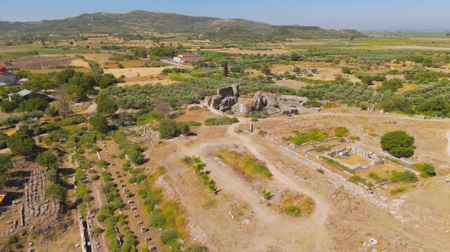 Balat, Turkey. Baths of Faustina, monumental Roman thermal complex with vaulted stone ruins and palaestra, aerial drone view under clear summer sky. Aerial View, Point of interest