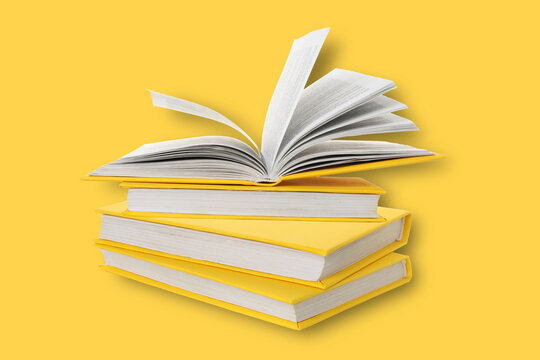 Books are shown on a yellow background with one book open