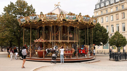 Traditional Ornate Carousel in a Public Square in Bordeaux France © blueringmedia