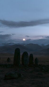 Ancient monoliths rise from a desolate landscape bathed in twilight&rsquo;s ethereal lunar glow