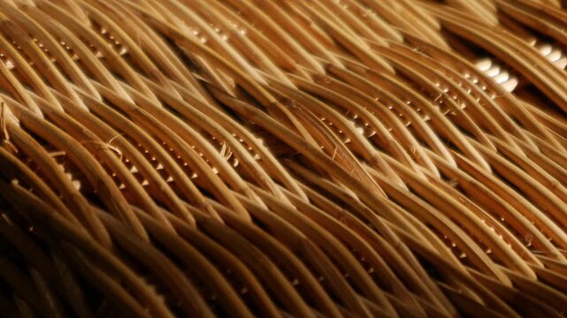 Woven Rattan Wicker Texture with Warm Sunlight, Close-Up Natural Basket Weave Pattern