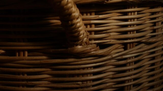 Woven Rattan Wicker Texture with Warm Sunlight, Close-Up Natural Basket Weave Pattern
