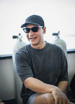 Smiling man in sunglasses on a boat