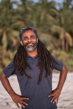 Happy man with dreadlocks and a beard smiling