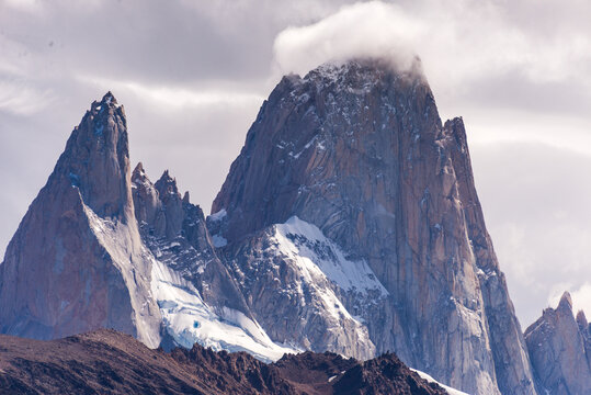 Dramatic Mountain Peaks with Snow and Clouds in Mountainous Landscape