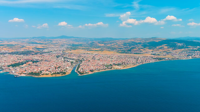 Canakkale, Turkey. Panoramic aerial view of the city on the Asian shore of the Dardanelles Strait, a vibrant Turkish port with ferry terminals and waterfront promenade on a sunny day. Aerial view