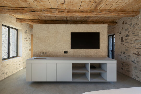 Interior modern room. No people inside. Stone wall.