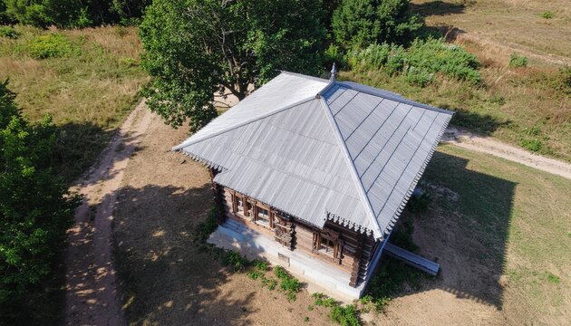 Aerial view of traditional wooden house in rural landscape