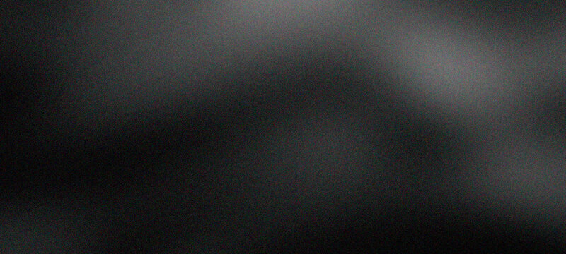 Dynamic black background with subtle light nuances and fine grain texture, creating an elegant and versatile visual, ideal for contemporary design templates and overlays for cover, banners, header