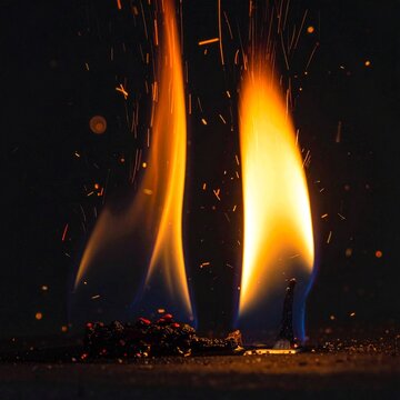 Fiery Flames Rising From Charred Surface