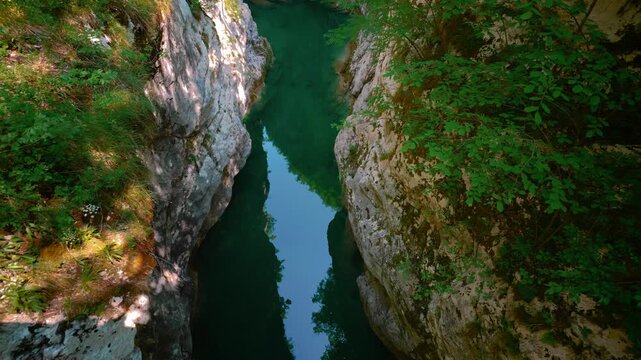 Sentiero del Dint perspective looking down at emerald pools inside Cellina gorge, Northern Italy.