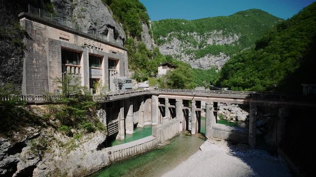Historic Diga del Cellina old dam structure built into the rocky cliffs of Barcis canyon, Northern Italy.