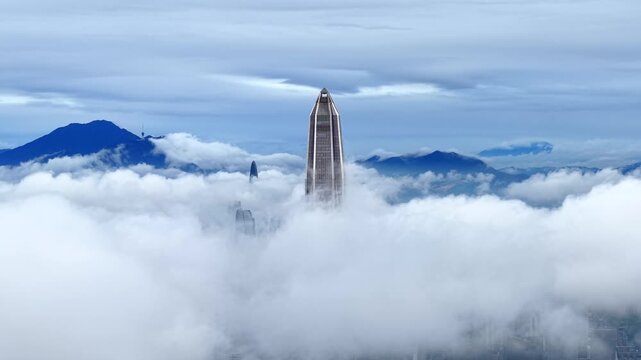 Aerial footage of Ping An Finance Center above cloud sea in Shenzhen
Panoramic drone view of Shenzhen urban skyline and Wutong Mountain
Cityscape aerial shot of Futian CBD skyscrapers surrounded