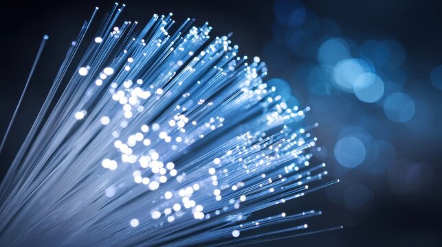 Bright bundle of glowing flexible optical fibers transmitting data and light, showcasing advanced communication technology.