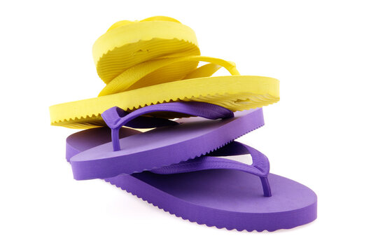 Two pairs of flipflops on white