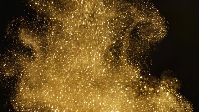 Golden glitter explosion on a black background