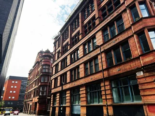 Red brick Victorian commercial building facade on Lenna Street in Manchester, UK with urban architecture and street windows © AS Photo Family