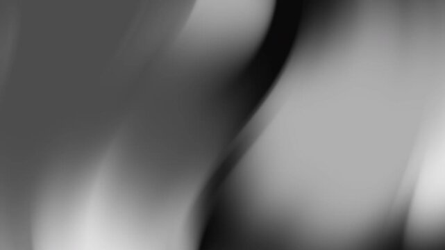 Soft grayscale curves with abstract smooth patterns and light shadows, suitable for design projects needing a monochrome gradient blur aesthetic.