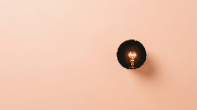Minimalist Concept of a Glowing Light Bulb Mounted on a Pastel Wall Representing Inspiration and Creative Ideas