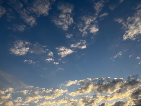 Golden twilight clouds glowing along the horizon under a navy blue sky.