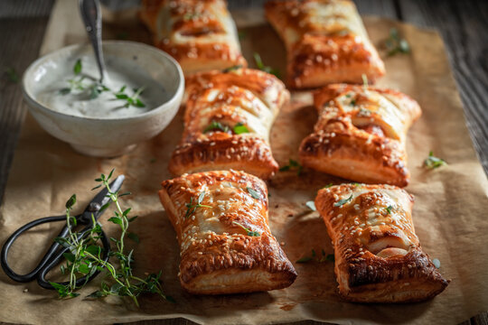 Crispy sausage roll with tatar sauce and herbs.