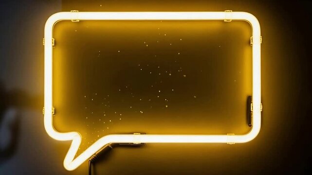 A bright yellow neon sign shaped like a speech bubble glows against a dark background, with subtle sparkling effects.