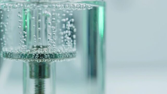 Extreme close up of a hydrogen generator producing oxygen and hydrogen bubbles through the electrolysis of water, a key process in creating renewable and sustainable clean energy