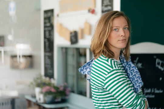 Portrait of young woman in a cafe