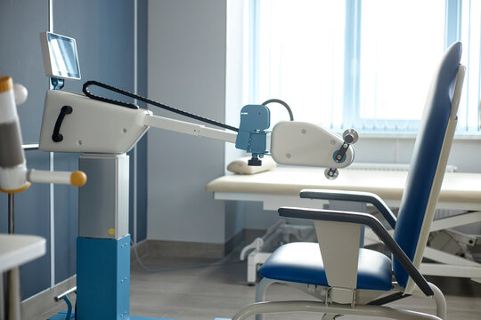 Modern rehabilitation equipment stands empty in a physiotherapy clinic