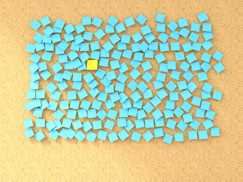Single yellow sticky note among blue ones on a corkboard