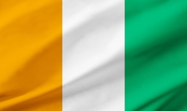 Ivory Coast flag background with waving fabric texture