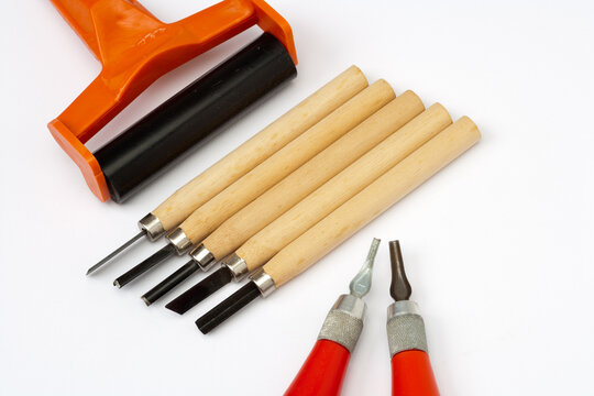 Art and crafts - linocut tools on white paper