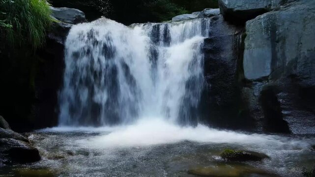 Stream water splashing over miniature waterfalls