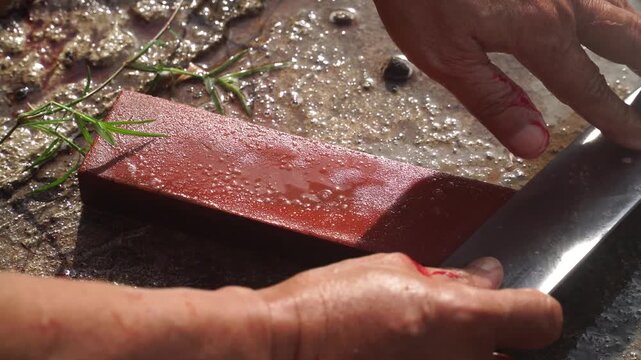 Close Up of Blade Sharpening Process on Traditional Whetstone