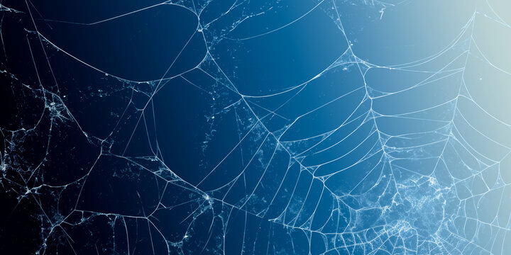 Abstract Broken Glass Texture and White Spiderweb Pattern on Blue Gradient Background