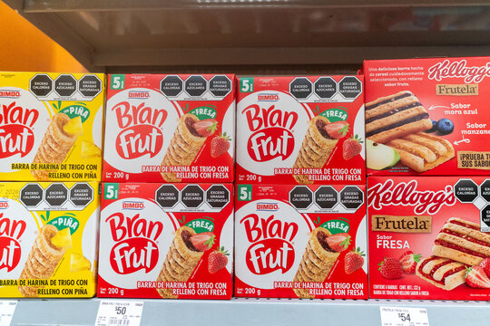 Villa de Alvarez, Colima. Mexico. June 26, 2026: Bimbo Bran Frut and Kellogg's Frutela Snack Bars Displayed on Supermarket Shelf