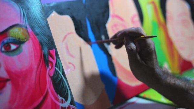 A close-up tracks a row of cinema-inspired rickshaw metal boards as a Bangladeshi artisan hand-brushes character details, preserving a vanishing vintage pop culture transport art in Dhaka.