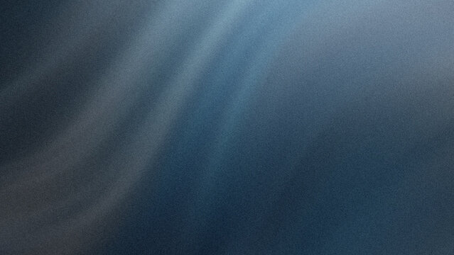 A close up view of dark blue denim fabric showing the textured weave and diagonal twill pattern