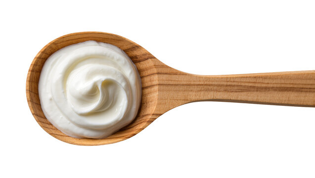 Isolated wooden spoon with a delicious dollop of creamy white yogurt or fresh sour cream.